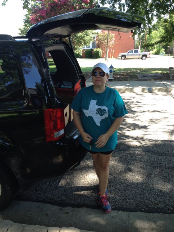 This food pantry volunteer collects food to place in the food pantry boxes placed around the McKinney town square.